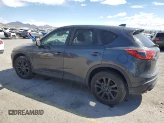 2015 Mazda CX-5 Grand Touring with VIN JM3KE4DY9F0536771, listed as a Copart auction lot 51801775 with 88,529 mi miles and Salvage Title. Bid and sale history available at DreamBid. Image 2.
