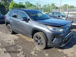 2019 Toyota RAV4 Hybrid XSE with VIN JTMEWRFV9KD507695, listed as a IAAI auction lot 42554511 with 137,000 mi miles and . Bid and sale history available at DreamBid. Image 1.