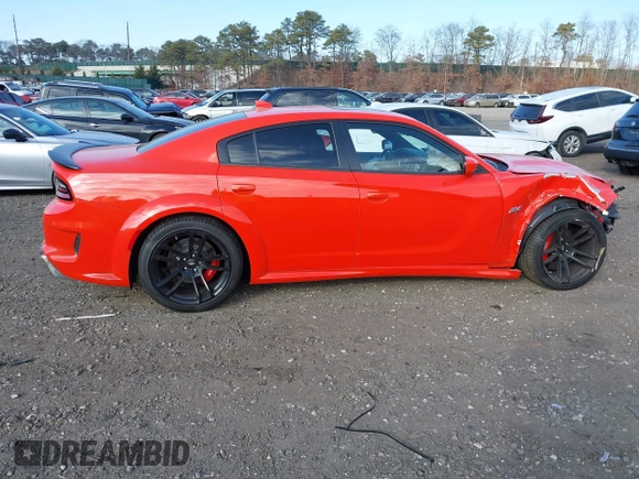 2022 Dodge Charger Scat Pack Widebody with VIN 2C3CDXGJ3NH101081, listed as a IAAI auction lot 41351466 with 9,575 mi miles and . Bid and sale history available at DreamBid. Image 5.