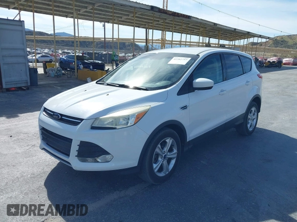 2014 Ford Escape SE with VIN 1FMCU9GX0EUD05633, listed as a IAAI auction lot 41582757 with 103,729 mi miles. Bid and sale history available at carsss.com. Image 2.