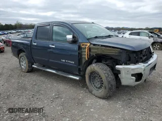 2015 Nissan Titan SV with VIN 1N6AA0EC9FN500624, listed as a Copart auction lot 50982985 with 128,976 mi miles and Salvage title. Bid and sale history available at DreamBid. Image 4.