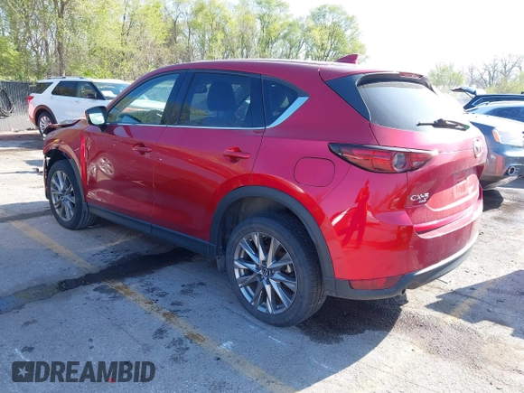 2021 Mazda CX-5 Grand Touring with VIN JM3KFBDM8M1390188, listed as a IAAI auction lot 42000444 with 84,908 mi miles. Bid and sale history available at carsss.com. Image 3.
