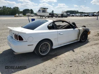 1996 Ford Mustang Cobra с VIN 1FALP47V4TF118643, выставлен на аукционе Copart как лот 57999885 с пробегом Не указан миль и Списание • Salvage title. История ставок и продаж доступна на DreamBid. Изображение 3.