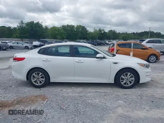 2017 Kia Optima LX z VIN 5XXGT4L32HG161091, wystawiony jako IAAI lot #42266149 z przebiegiem 166 254 mil mil oraz . Historia ofert i sprzedaży dostępna na DreamBid. Obrazek 13.