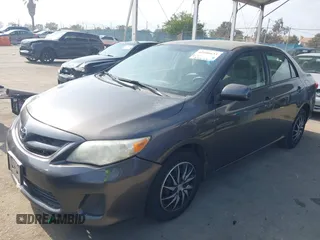 2011 Toyota Corolla L with VIN JTDBU4EE3BJ090749, listed as a IAAI auction lot 42106633 with 209,824 mi miles. Bid and sale history available at carsss.com. Image 2.