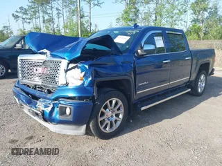 2015 GMC Sierra 1500 Denali z VIN 3GTP1WEC2FG201307, wystawiony jako IAAI lot #41931366 z przebiegiem 99 644 mil mil oraz . Historia ofert i sprzedaży dostępna na DreamBid. Obrazek 2.