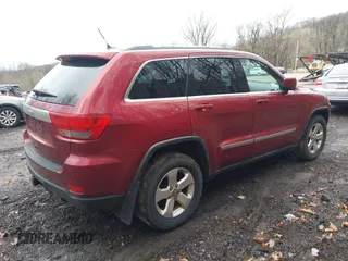 2012 Jeep Grand Cherokee Laredo with VIN 1C4RJFAG7CC123669, listed as a IAAI auction lot 42001472 with 164,806 mi miles. Bid and sale history available at carsss.com. Image 4.