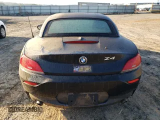 2011 BMW Z4 sDrive35i with VIN WBALM7C5XBE383093, listed as a Copart auction lot 74487034 with 0 mi miles and Salvage Title. Bid and sale history available at carsss.com. Image 6.