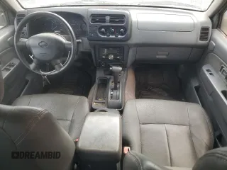 2001 Nissan Frontier SE z VIN 1N6ED27T51C307408, wystawiony jako Copart lot #57169705 z przebiegiem 323 598 mil mil oraz Czysty tytuł • Clean title. Historia ofert i sprzedaży dostępna na DreamBid. Obrazek 8.