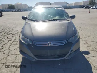 2011 Honda Insight EX z VIN JHMZE2H71BS006434, wystawiony jako Copart lot #58045495 z przebiegiem 270 645 mil mil oraz Czysty tytuł • Clean title. Historia ofert i sprzedaży dostępna na DreamBid. Obrazek 5.