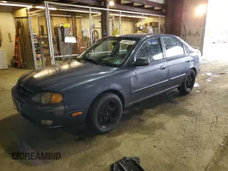 2003 Kia Spectra GS z VIN KNAFB161135104592, wystawiony jako Copart lot #52097205 z przebiegiem 119 206 mil mil oraz Szkoda całkowita • Salvage title. Historia ofert i sprzedaży dostępna na DreamBid. Obrazek 1.