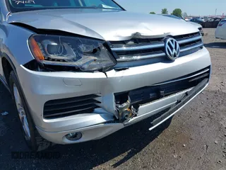 2014 Volkswagen Touareg Sport with VIN WVGEF9BP6ED007436, listed as a IAAI auction lot 41953307 with 114,925 mi miles and . Bid and sale history available at DreamBid. Image 6.