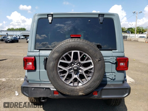 2024 Jeep Wrangler Sahara with VIN 1C4PJXEGXRW269062, listed as a Copart auction lot 64576895 with 2,159 mi miles and Salvage title. Bid and sale history available at DreamBid. Image 6.