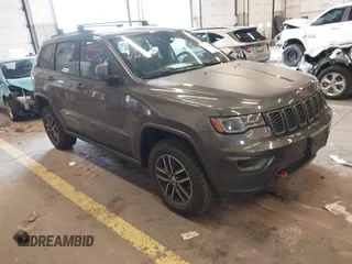 2018 Jeep Grand Cherokee Trailhawk with VIN 1C4RJFLTXJC361572, listed as a IAAI auction lot 41827888 with 73,015 mi miles and . Bid and sale history available at DreamBid. Image 1.