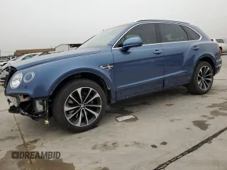 2019 Bentley Bentayga V8 z VIN SJAAM2ZV5KC024865, wystawiony jako Copart lot #42869533 z przebiegiem 23 687 mil mil oraz . Historia ofert i sprzedaży dostępna na DreamBid. Obrazek 1.