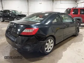 2010 Honda Civic Cpe LX with VIN 2HGFG1B69AH531712, listed as a IAAI auction lot 41235917 with 84,521 mi miles. Bid and sale history available at carsss.com. Image 4.