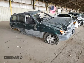 1996 Jeep Grand Cherokee Laredo with VIN 1J4GZ58S6TC304597, listed as a Copart auction lot 52962545 with Not provided miles and Salvage title. Bid and sale history available at DreamBid. Image 4.