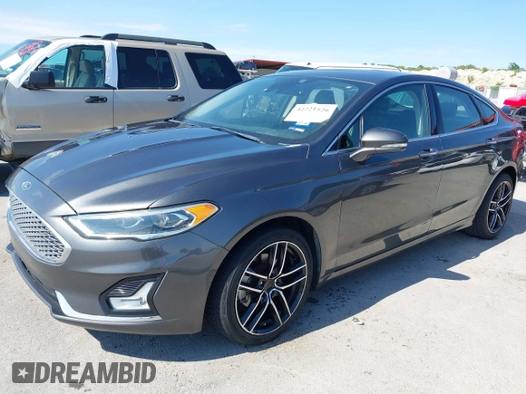 2019 Ford Fusion Titanium with VIN 3FA6P0D91KR104827, listed as a IAAI auction lot 42221526 with 141,316 mi miles and . Bid and sale history available at DreamBid. Image 18.