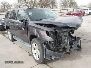 2015 Chevrolet Tahoe LT with VIN 1GNSCBKC5FR504459, listed as a IAAI auction lot 41689405 with 141,783 mi miles and . Bid and sale history available at DreamBid. Image 1.