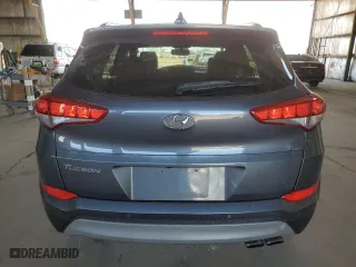2018 Hyundai Tucson Value with VIN KM8J33A23JU823248, listed as a Copart auction lot 42967005 with 107,295 mi miles and Salvage Title. Bid and sale history available at carsss.com. Image 6.