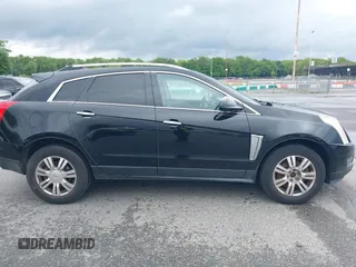 2015 Cadillac SRX Luxury Collection z VIN 3GYFNEE34FS510360, wystawiony jako IAAI lot #42343737 z przebiegiem 149 046 mil mil oraz . Historia ofert i sprzedaży dostępna na DreamBid. Obrazek 13.