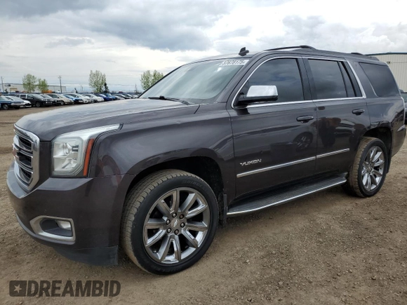 2015 GMC Yukon SLT z VIN 1GKS2BKCXFR269881, wystawiony jako Copart lot #57678175 z przebiegiem 256 703 mil mil oraz Czysty tytuł • Clean title. Historia ofert i sprzedaży dostępna na DreamBid. Obrazek 1.