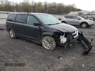 2019 Dodge Grand Caravan SXT with VIN 2C4RDGCG4KR580424, listed as a Copart auction lot 52715245 with 130,696 mi miles and Salvage Title. Bid and sale history available at DreamBid. Image 4.