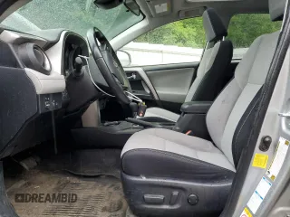 2018 Toyota RAV4 XLE with VIN JTMRFREV2JJ200677, listed as a Copart auction lot 59660535 with 82,283 mi miles and Salvage title. Bid and sale history available at DreamBid. Image 7.