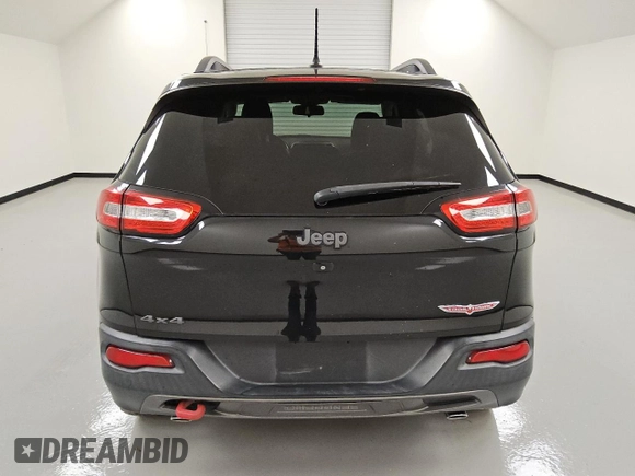 2015 Jeep Cherokee Trailhawk with VIN 1C4PJMBSXFW746138, listed as a Copart auction lot 49877985 with 86,820 mi miles and Clean Title. Bid and sale history available at carsss.com. Image 6.