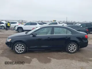 2014 Volkswagen Jetta Sedan SE w/Connectivity with VIN 3VWD07AJ4EM370905, listed as a IAAI auction lot 41472856 with 146,662 mi miles. Bid and sale history available at carsss.com. Image 14.