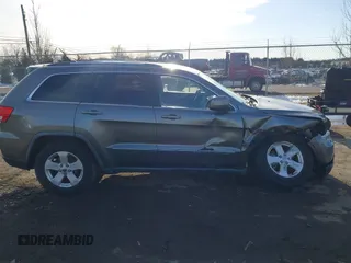 2011 Jeep Grand Cherokee 70th Anniversary with VIN 1J4RR4GT6BC715848, listed as a IAAI auction lot 41562152 with 119,910 mi miles. Bid and sale history available at carsss.com. Image 13.
