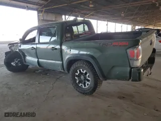 2022 Toyota Tacoma 4WD SR with VIN 3TYCZ5AN0NT055986, listed as a Copart auction lot 50165995 with 52,628 mi miles and Salvage Title. Bid and sale history available at carsss.com. Image 2.