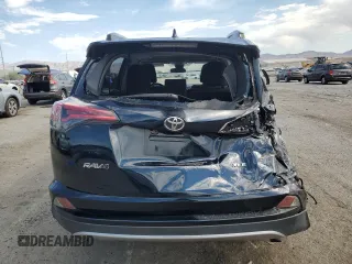 2018 Toyota RAV4 XLE with VIN JTMWFREV7JD130465, listed as a Copart auction lot 63314795 with 97,334 mi miles and Salvage title. Bid and sale history available at DreamBid. Image 6.
