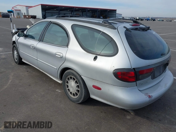 1999 Ford Taurus SE z VIN 1FAFP58S4XA299009, wystawiony jako IAAI lot #41775412 z przebiegiem 80 634 mil mil oraz . Historia ofert i sprzedaży dostępna na DreamBid. Obrazek 3.