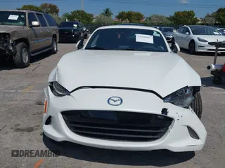 2021 Mazda MX-5 Miata Grand Touring z VIN JM1NDAM75M0450871, wystawiony jako IAAI lot #42060495 z przebiegiem 48 670 mil mil oraz . Historia ofert i sprzedaży dostępna na DreamBid. Obrazek 6.