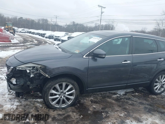 2014 Mazda CX-9 Grand Touring with VIN JM3TB3DV9E0440506, listed as a IAAI auction lot 41537718 with 217,299 mi miles and . Bid and sale history available at DreamBid. Image 19.