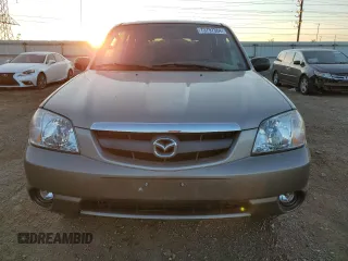2002 Mazda Tribute LX with VIN 4F2YU09142KM22895, listed as a Copart auction lot 73797364 with 176,514 mi miles and Salvage Title. Bid and sale history available at carsss.com. Image 5.