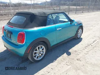 2016 MINI Convertible z VIN WMWWG5C53G3C18842, wystawiony jako IAAI lot #41864596 z przebiegiem 91 253 mil mil oraz . Historia ofert i sprzedaży dostępna na DreamBid. Obrazek 4.