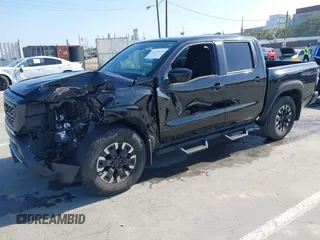 2024 Nissan Frontier SL with VIN 1N6ED1EJ4RN650125, listed as a IAAI auction lot 42193443 with 14,282 mi miles and . Bid and sale history available at DreamBid. Image 2.