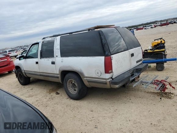 1999 Chevrolet Suburban with VIN 1GNEC16R7XJ418169, listed as a Copart auction lot 88995495 with 2,015,240 mi miles and Salvage title. Bid and sale history available at DreamBid. Image 2.