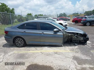 2021 Volkswagen Jetta S z VIN 3VWC57BU4MM009727, wystawiony jako IAAI lot #42339309 z przebiegiem 52 395 mil mil oraz . Historia ofert i sprzedaży dostępna na DreamBid. Obrazek 14.