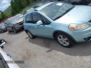 2009 Suzuki SX4 Touring AWD z VIN JS2YB417096201672, wystawiony jako IAAI lot #42209018 z przebiegiem 64 879 mil mil oraz . Historia ofert i sprzedaży dostępna na DreamBid. Obrazek 14.