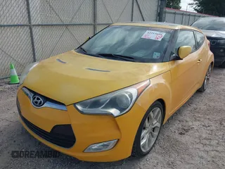 2012 Hyundai Veloster w/Gray Int z VIN KMHTC6AD7CU026855, wystawiony jako IAAI lot #42253694 z przebiegiem 119 802 mil mil oraz . Historia ofert i sprzedaży dostępna na DreamBid. Obrazek 6.