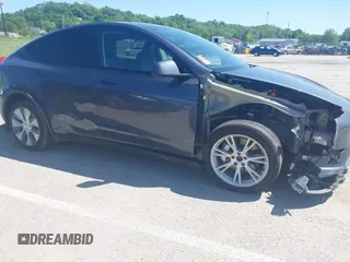 2023 Tesla Model Y Long Range with VIN 7SAYGDEE4PA037218, listed as a IAAI auction lot 42232704 with 18,756 mi miles and . Bid and sale history available at DreamBid. Image 6.