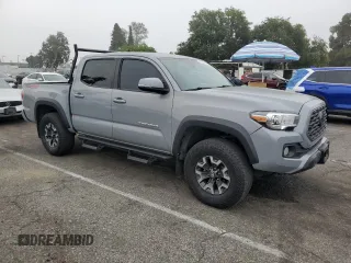 2021 Toyota Tacoma SR with VIN 3TMCZ5AN4MM402889, listed as a Copart auction lot 59942695 with 61,504 mi miles and Salvage title. Bid and sale history available at DreamBid. Image 4.