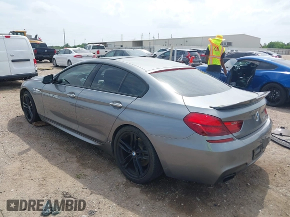 2014 BMW 6 Series 650i z VIN WBA6B2C55ED128934, wystawiony jako IAAI lot #42070641 z przebiegiem 102 597 mil mil oraz . Historia ofert i sprzedaży dostępna na DreamBid. Obrazek 3.