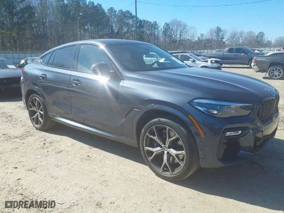 2021 BMW X6 M50i with VIN 5UXCY8C07M9E32426, listed as a IAAI auction lot 41715641 with 23,000 mi miles. Bid and sale history available at carsss.com. Image 1.