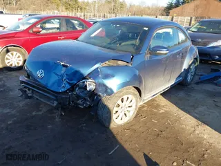 2019 Volkswagen Beetle S with VIN 3VWFD7AT5KM708953, listed as a IAAI auction lot 41440200 with 54,430 mi miles. Bid and sale history available at carsss.com. Image 2.