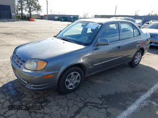 2004 Hyundai Accent GL with VIN KMHCG45C04U531177, listed as a IAAI auction lot 41526033 with 126,102 mi miles. Bid and sale history available at carsss.com. Image 2.