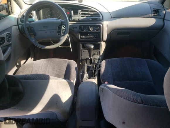 1996 Ford Contour z VIN 1FALP65L5TK212857, wystawiony jako Copart lot #76701614 z przebiegiem 74 994 mil mil oraz Szkody całkowita. Historia ofert i sprzedaży dostępna na DreamBid. Obrazek 8.